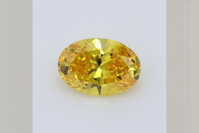0.47 Carat Oval Yellow Lab Diamond