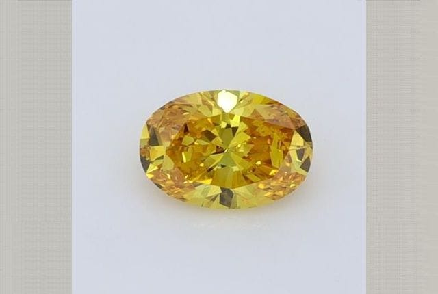 0.41 Carat Oval Yellow Lab Diamond