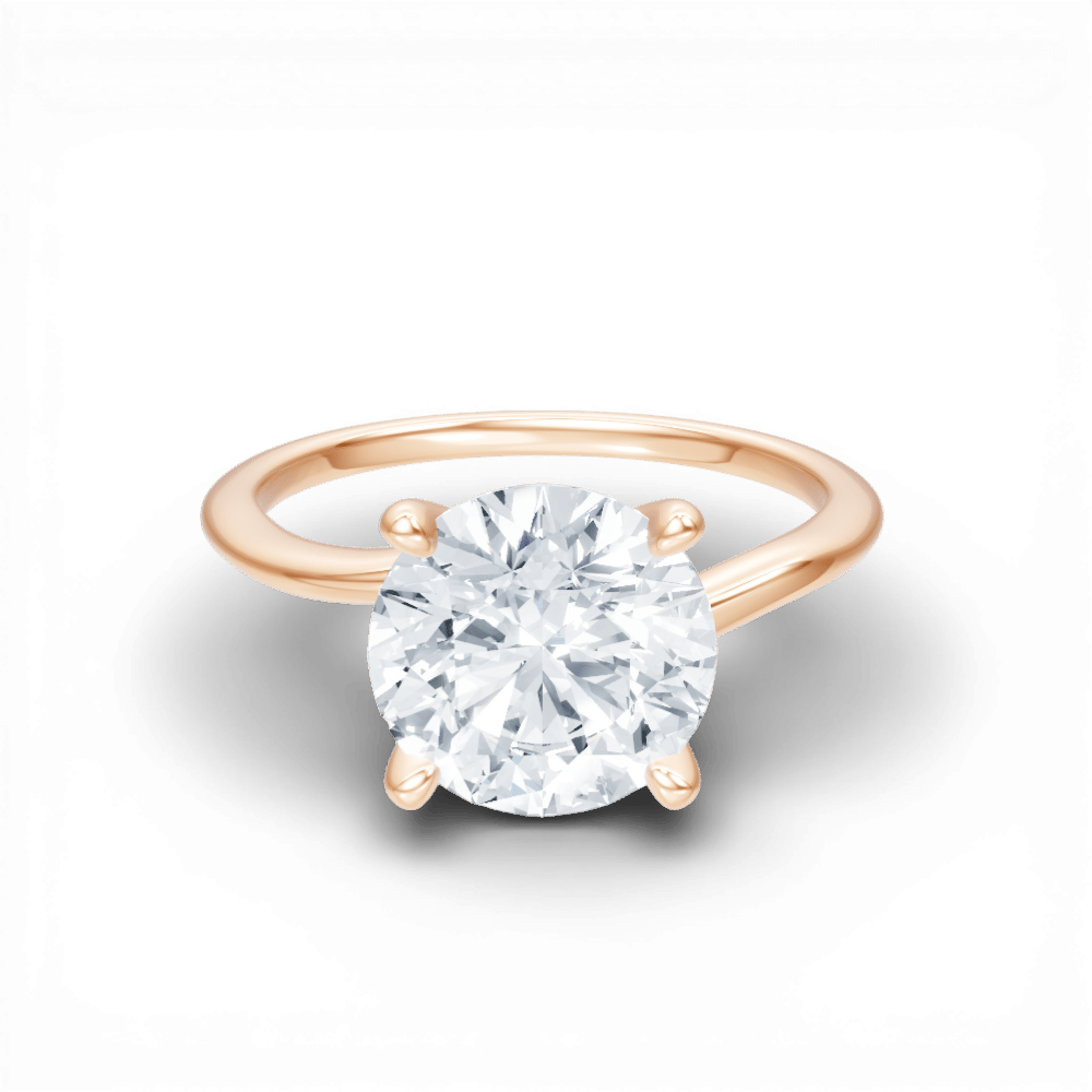 The Geneva Round Cut 18kt Rose Gold Four-Prong Solitaire Engagement Ring