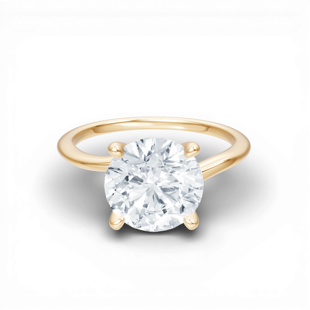 The Geneva Round Cut 18kt Yellow Gold Four-Prong Solitaire Engagement Ring