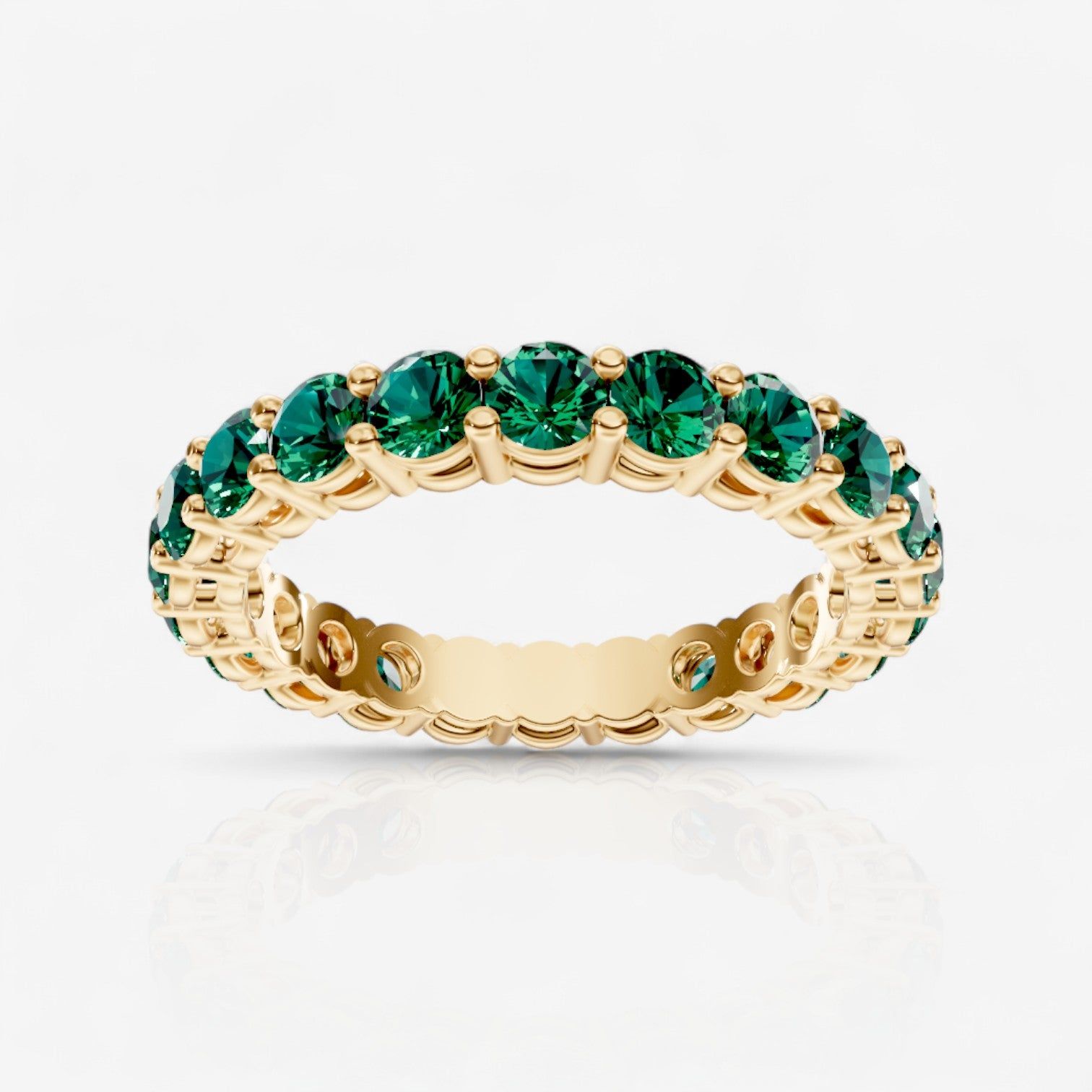 Round Shared Prong Emerald Eternity Band