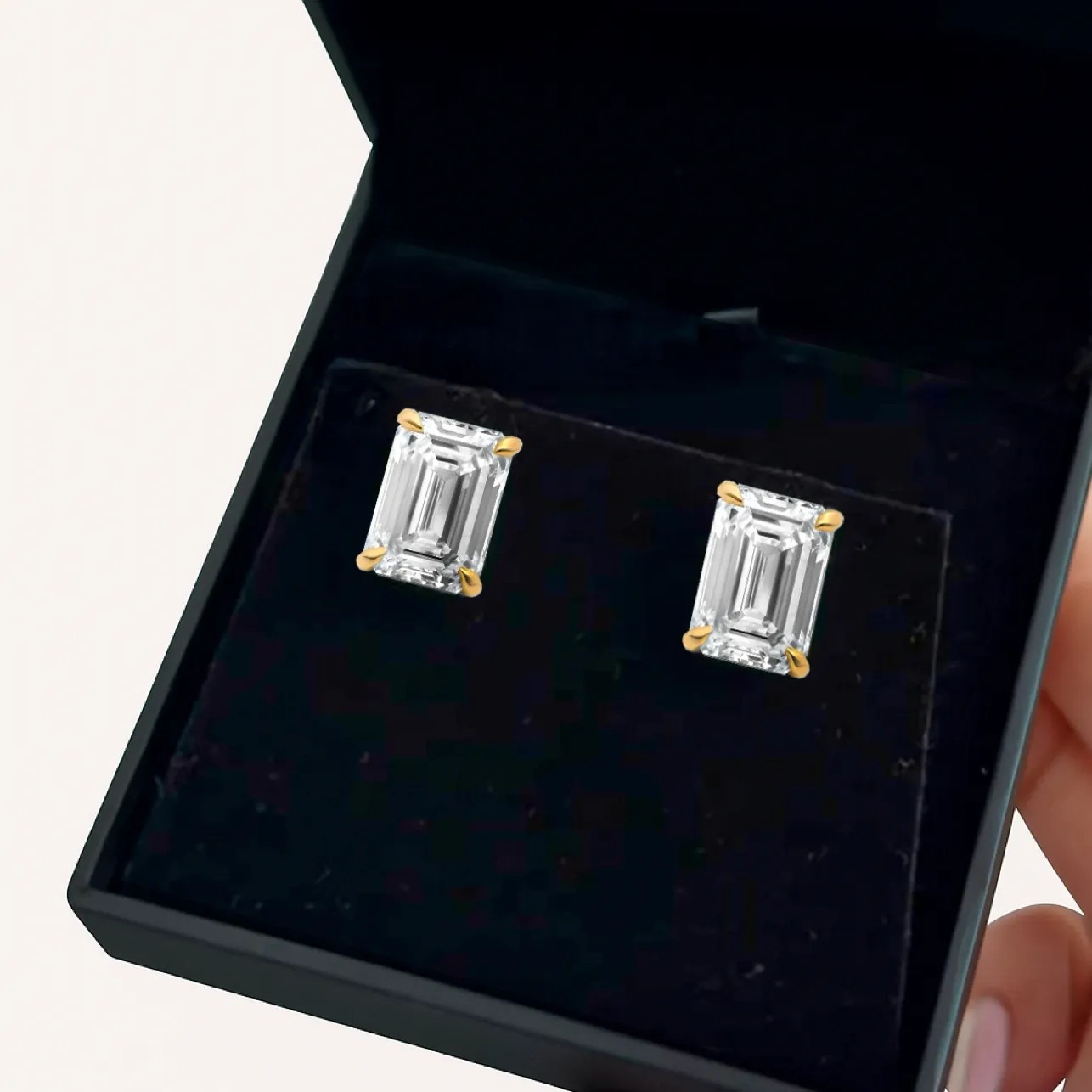 Emerald cut diamond stud earrings in 18kt Yellow Gold in a Black Ritani Jewelry Box
