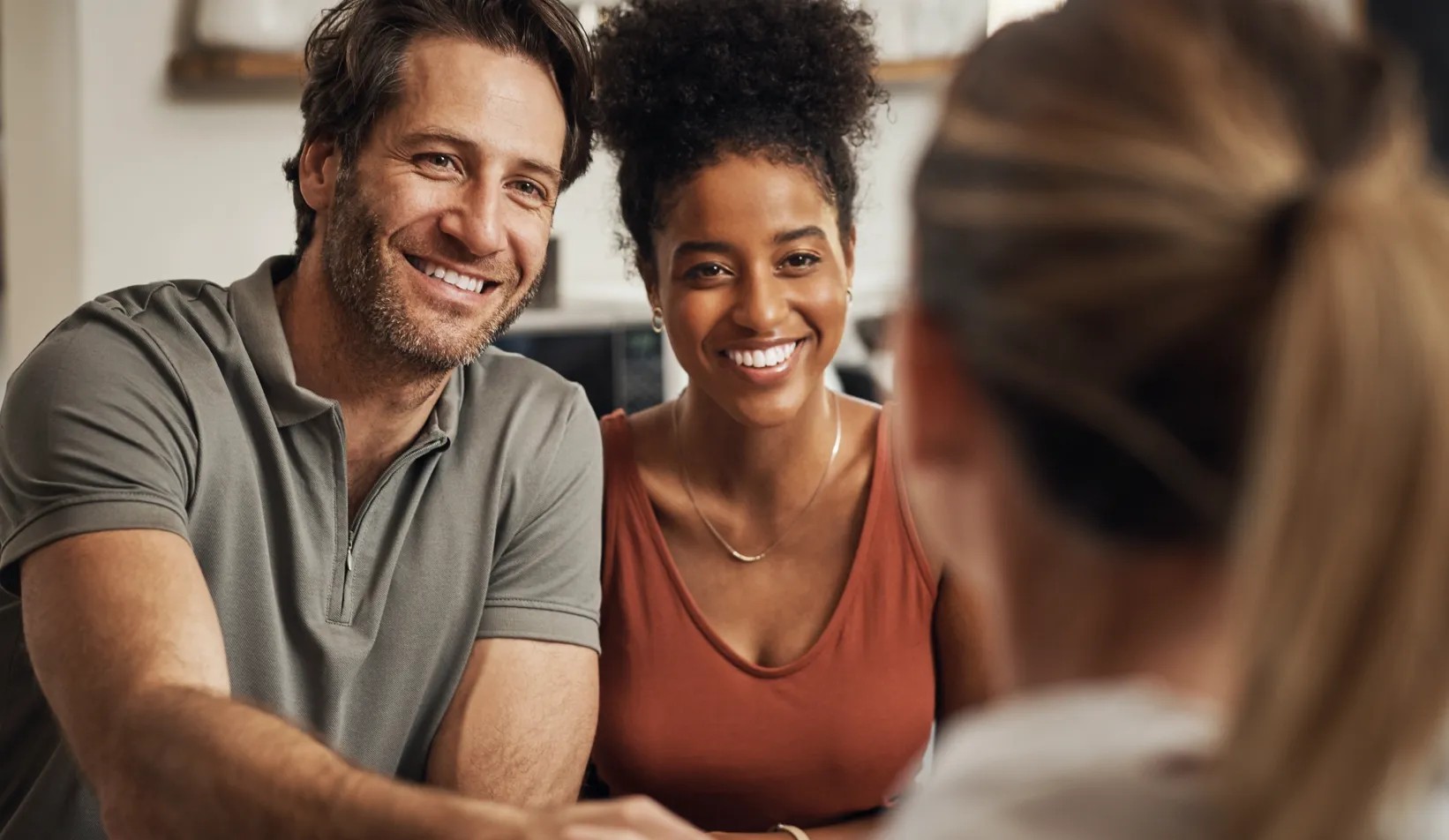 A couple meeting with a Gemologist to review a diamond order
