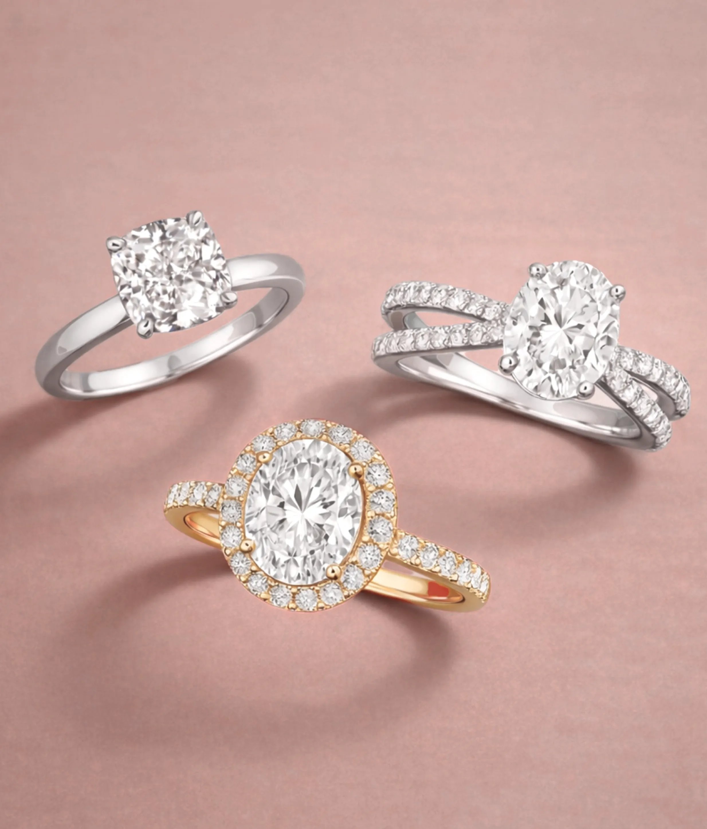 solitaire, sidestone, and halo engagement ring next to each other