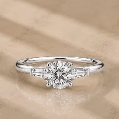 three stone engagement ring on neutral background