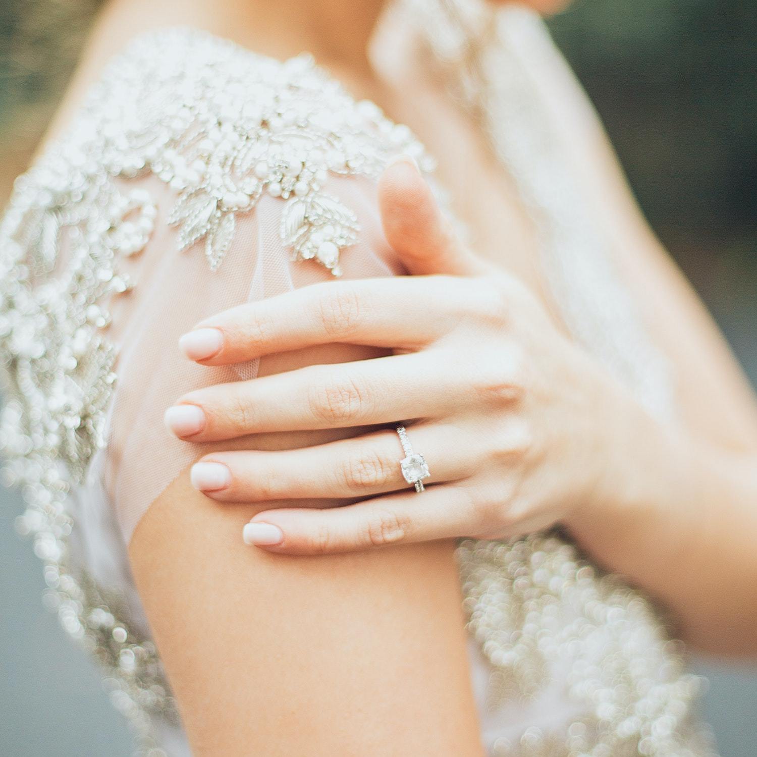 bride wearing engagement ring