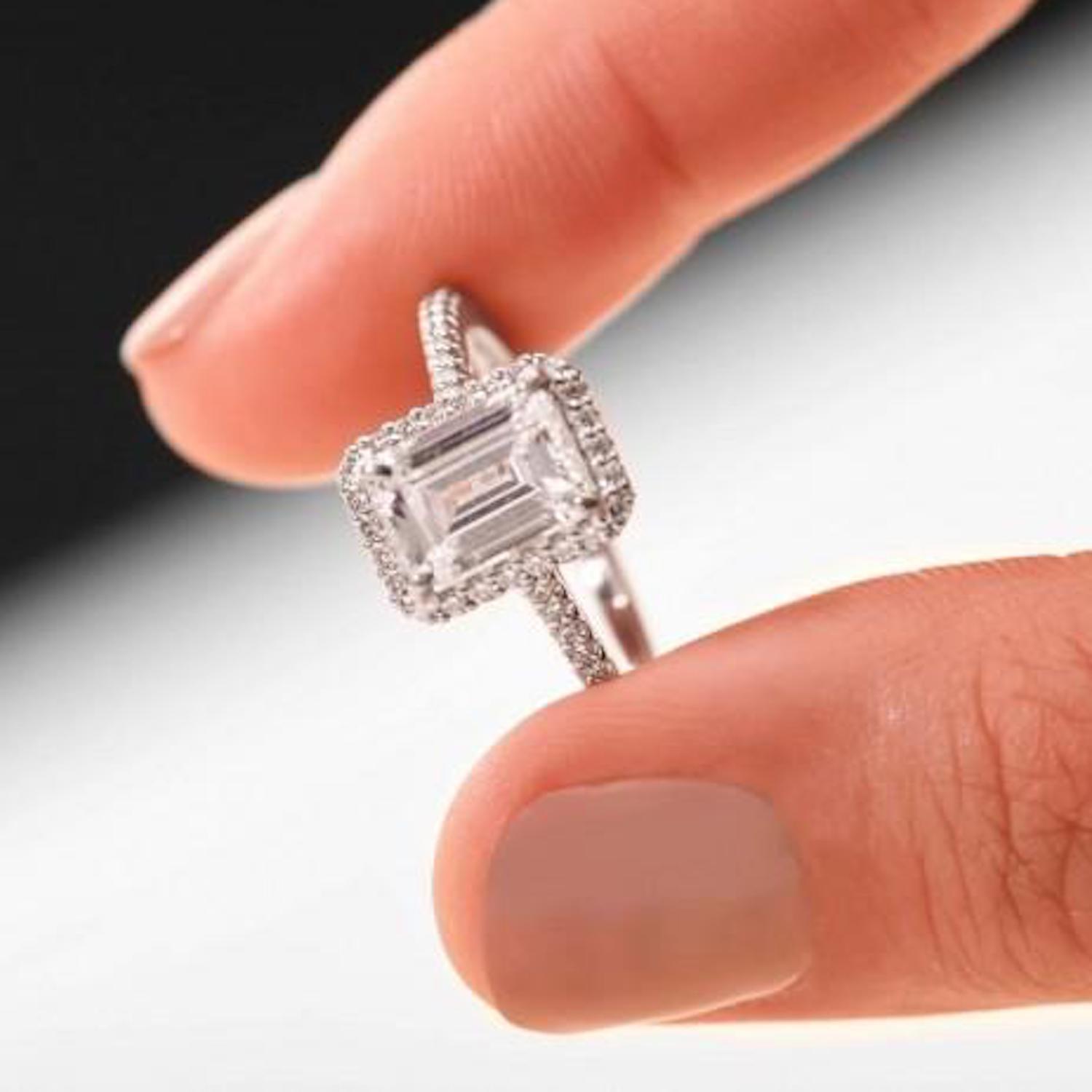 Emerald cut engagement ring with halo
