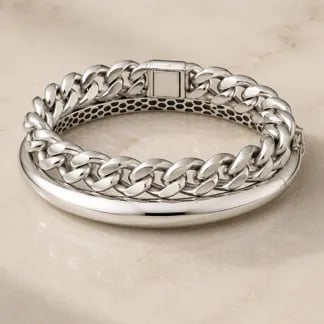 white gold chain bangle stacked on top of a white gold bracelet