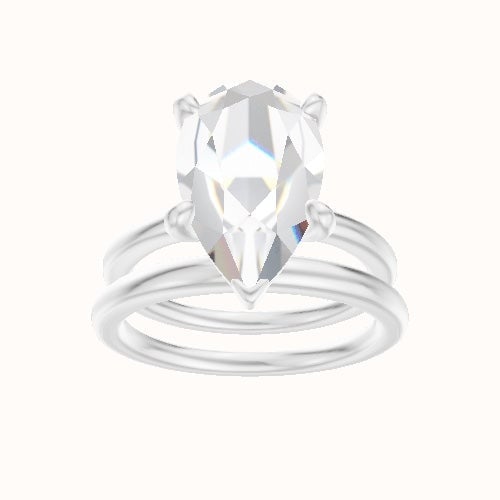Solitaire Engagement Ring With Low Set Four Prong Head and Matching Band